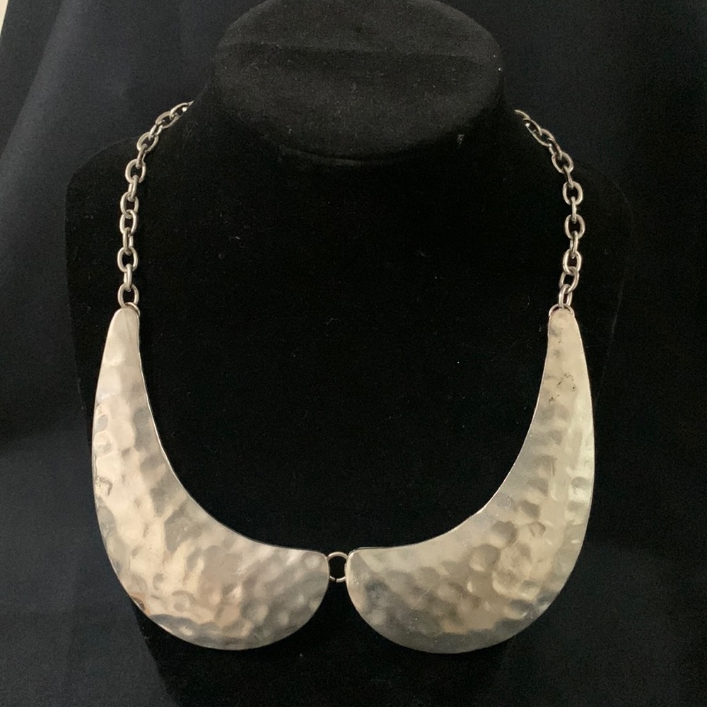 Silver collar statement necklace.